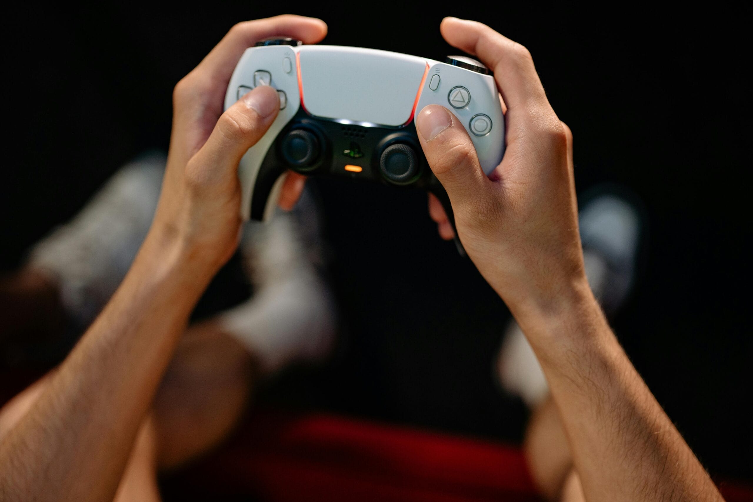 Understanding Player Motivation - - A person holding a game controller.